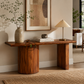SCULPTURAL WOODEN DINING TABLE WITH CURVED PEDESTAL AND PANEL BASE