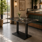 BLACK MARBLE-TOP DINING TABLE WITH DOUBLE COLUMN PLATFORM BASE